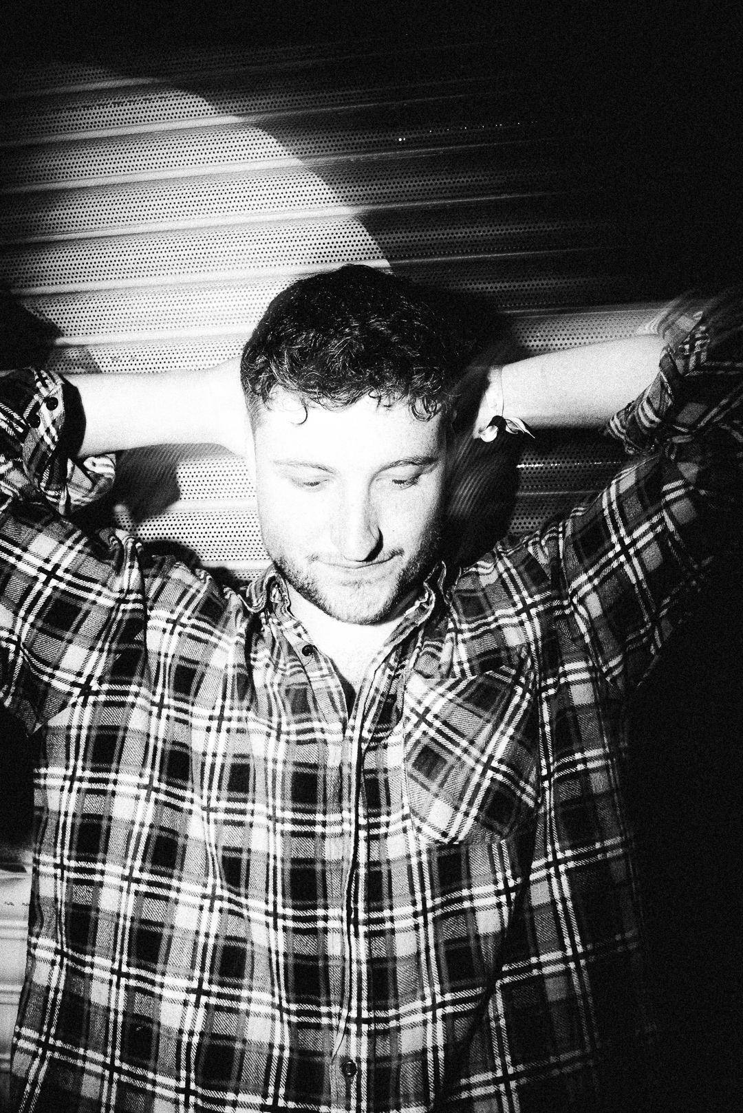No Rest For The Spacemen band member wearing a plaid shirt